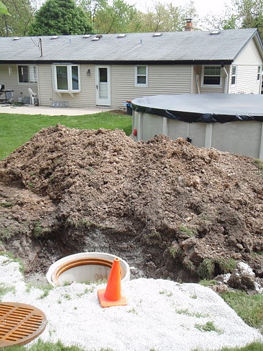 Bob's Grading installs catch basins to solve drainage issues.